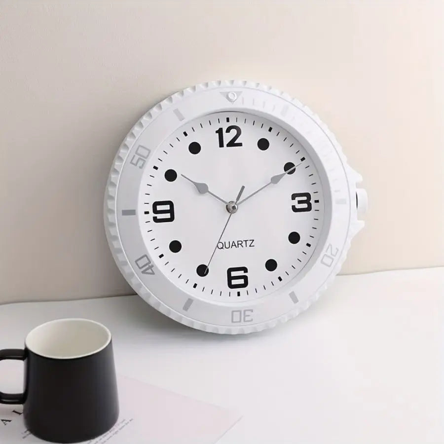 White wall clock in the shape of a watch