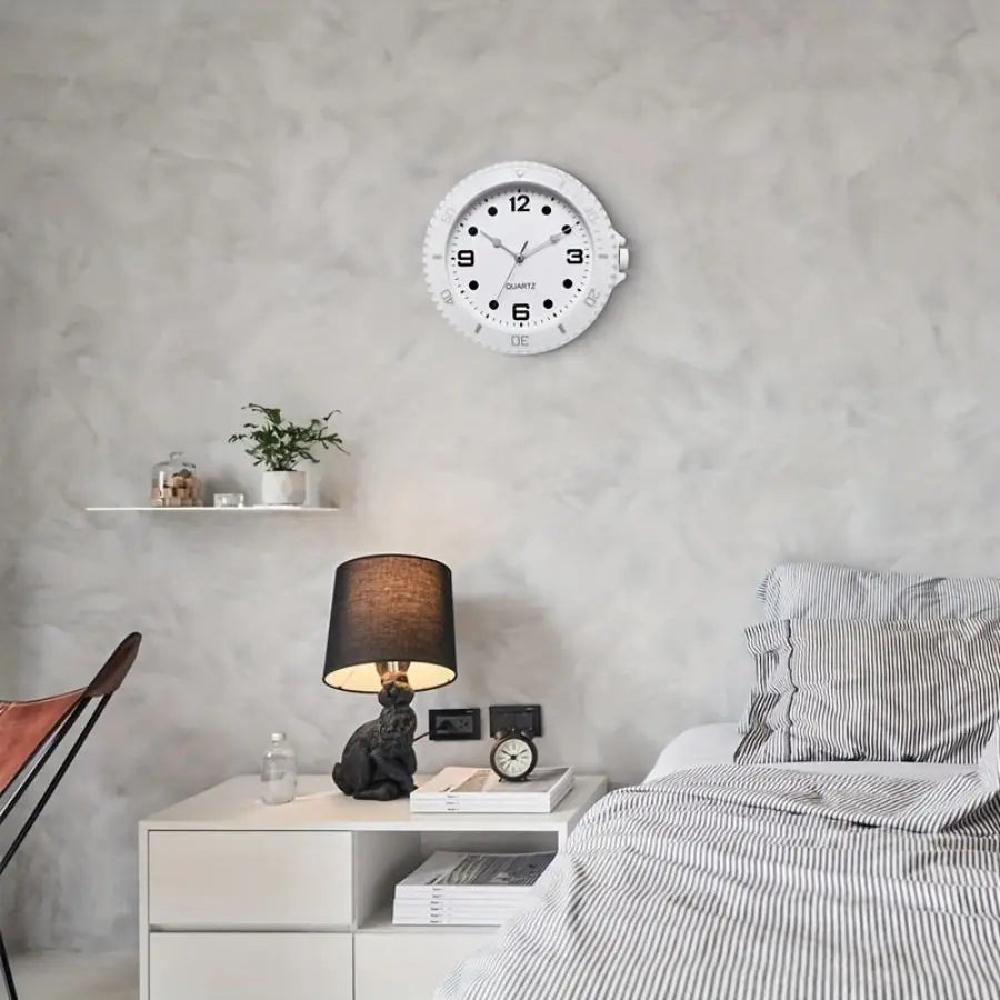 White wall clock in the shape of a watch