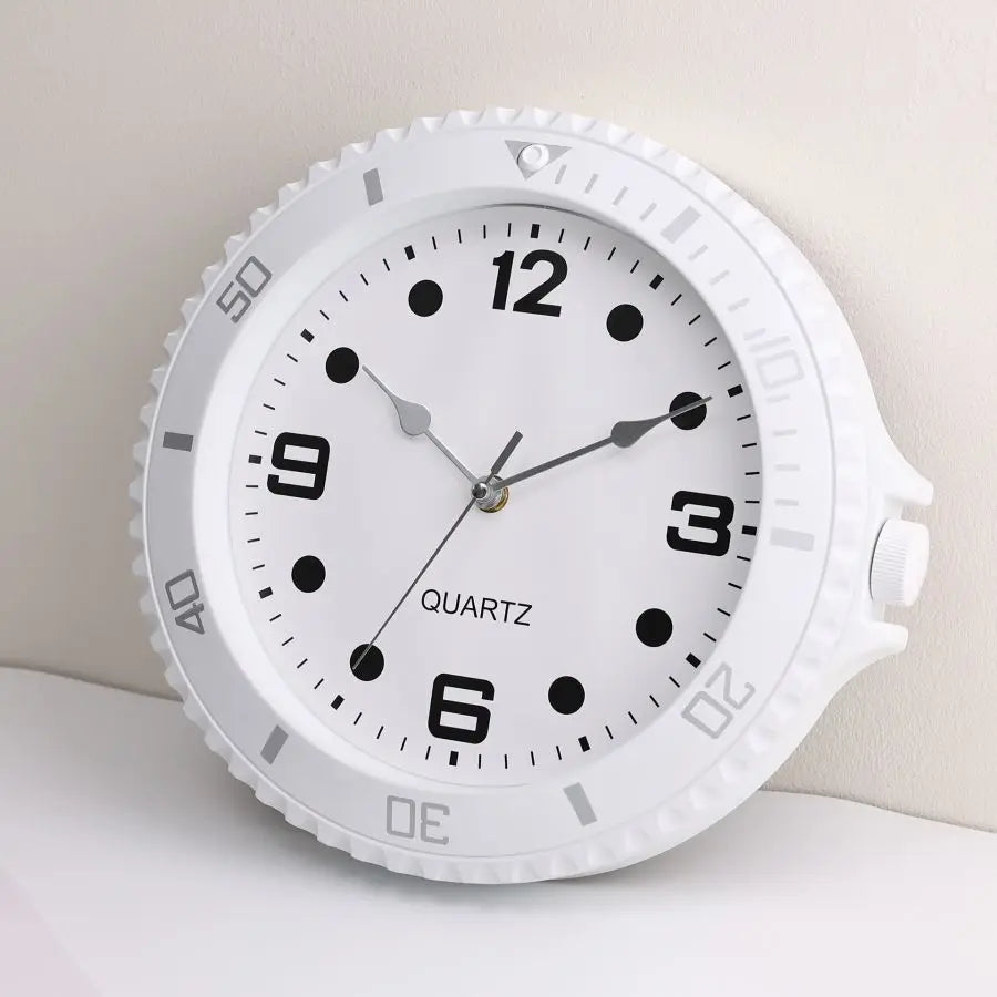 White wall clock in the shape of a watch